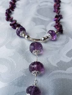 Beautiful Y necklace made with faceted Amethyst beads and Pearl's. Surrounded with sterling beads and clasp. Elegant Amethyst Rondelle Necklaces, Elegant Amethyst Rondelle Necklace, Elegant Purple Faceted Beads Gemstones, Elegant Amethyst Beaded Necklaces For Healing, Elegant Faceted Purple Crystal Necklace, Elegant Purple Faceted Crystal Necklace, Elegant Amethyst Beaded Necklace For Healing, Faceted Round Beads Lariat Necklace As Gift, Faceted Lariat Necklaces For Jewelry Making