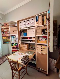 an organized craft room with lots of storage