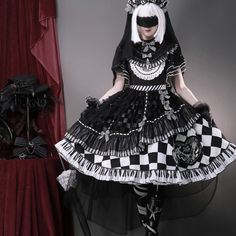 A dark and mysterious young lady. An elegant item that combines a black and white block check pattern with a piano keyboard pattern. Decorated frills and ribbons are intricately and architecturally deployed. You will be captivated by the dramatic impact, as if an elegant melody is being played. 
 
 
 
 What is included in your order 
 
 One Piece 
 Headband 
 Headdress 
 Gloves 
 Tights 
 
 
 Size(*Dress) 
 
 S size 
 
 Length: 100cm 
 Bust: 84cm 
 Waist: 72cm 
 
 M size 
 
 Length: 101cm 
 Bust Black And White Keyboard, White Keyboard, Dark And Mysterious, Piano Keyboard, Dresses Xxl, Gothic Dress, Check Pattern, Xl Dress, Headdress