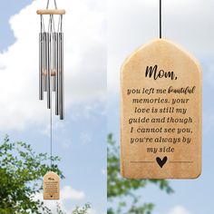 a memorial wind chime hanging from a tree with a poem written on the back