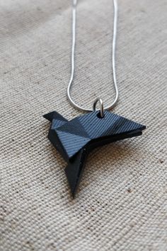 A lovingly necklace with a handmade pendant made from resin. Painted white or black. Thanks for looking, any questions please message me! Unique Black Geometric Jewelry, Geometric Black Jewelry For Gifts, Unique Black Necklaces For Gifts, Unique Black Necklace For Gift, Modern Black Geometric Necklace, Geometric Black Necklace For Gift, Minimalist Handmade Black Necklace, Black Geometric Necklace For Gift, Minimalist Black Necklace For Gift