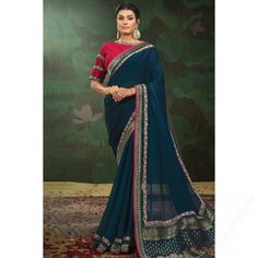 To complement your graceful demeanour, Andaaz Fashion presents this Prussian blue satin saree which makes you effortlessly fashionable. This round neck and half sleeve blouse is embroidered with patch and lace work. It is accompanied by a matching satin light weight saree in Prussian blue color perfectly formed using patch and lace work. This saree blouse can be customized up to the maximum size available in inches 58 around the bust. Navy Saree, Blue Silk Saree, Grey Saree, Latest Designer Sarees, Simple Sarees, Patch Embroidery