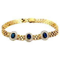 Bracelet Specifications: Metal: 18k Yellow Gold Sapphire Count: 3 Oval Sapphires Sapphire Carat Weight: ~ 2.0 carats Diamond Count: 54 Diamond Color: G Diamond Clarity: VS-SI1 Diamond Carat Weight: 0.50 Bracelet Length: ~7 inches Bracelet Width: ~ 11 mm Total Weight: 21.6 Grams Condition: Vintage, Excellent Stamped: "750" Everyday Bracelet, Diamond Halo, Sapphire Diamond, Diamond Clarity, Halo Diamond, Link Bracelets, Chain Bracelet, Colored Diamonds, Metallica