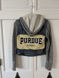 -Upcycled Women's Purdue University Denim Jacket -Second-hand materials may have small imperfections that enhance its individual character -French terry sleeves and hood -Women's size small -Perfect for a tailgate outfit for current students or alumni! -Ready to ship in 1-2 business days! Fitted Hooded Cotton Denim Jacket, Hooded Fitted Denim Jacket In Cotton, Tailgate Outfit, Purdue University, Womens Jackets, Denim Jacket Women, Nice Tops, Cute Shirts, French Terry