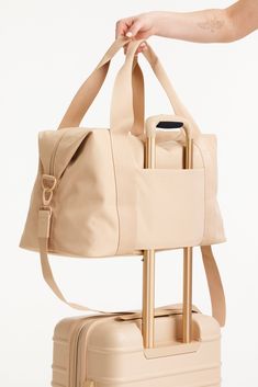 Béis 'The BEISICS Duffle' in Beige - Large Travel Duffle Bag in Beige Womens Overnight Bag, Versatile Weekender Bag, Versatile Weekender Bag With Luggage Sleeve For Weekend, Functional Weekend Gym Bag With Luggage Sleeve, Functional Weekend Duffle Bag, Versatile Rectangular Duffle Bag For Weekend, Functional Weekend Travel Bag With Luggage Sleeve, Rectangular Functional Duffle Bag For Weekend, Versatile Beige Duffle Bag