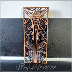 an art deco sculpture made out of wood and metal on a black background with the words reads creation above it