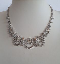 superb ART DECO rhodium plate hand prong set crystal paste rhinestone choker bib adjustable necklace with elaborate design - vintage. A beautiful ''something old'' for a bride or for any other special occasion! Good vintage condition will all stones in place.  inches end to end when closed. IMPORTANT TO READ: To make this a smooth and pleasant transaction experience for everyone, all buyers need to read and understand the description, the terms of sale , the payment and the shipping indicated in this listing. TERMS OF SALE A. SHIPPING WORLDWIDE This listing includes payable tracked services with the fees indicated below.  B. CARRIERS We don't ship with FedEx, DHL or UPS or any other carrier except for Canada Post unless a specific agreement with the buyer is accepted by us at our sole disc Rhinestone Choker, Wedding Bridal Jewellery, Something Old, Vintage Bridal, Glass Gifts, Adjustable Necklace, Necklace Vintage, Bib Necklace, Vintage Jewellery