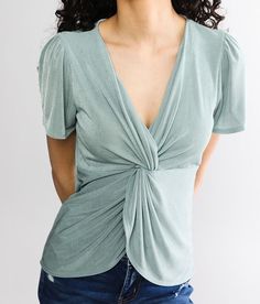 Red By BKE Twisted Front Top - Green Medium, Women's Seafoam Sheen v-neck top Bust measures 31 on size small Body length 23 on size small Model Info: Height: 5'9 | Bust: 32 | Waist: 22 1/2 | Hip: 34 1/2 | Wearing Size: Small. 91% Polyester 9% Spandex. Machine wash cold water with like colors. Gentle cycle. Reshape lay flat to dry. Do not bleach. Low iron if needed.. Measurements: Bust -Fullest part of bust with arms at sides. Waist -Circumference of natural waist: above belly button below rib ca Trendy V-neck Top With Twist Front, Fitted Solid Color V-neck Top, Summer V-neck Twist Front Tops, Trendy Fitted Tops With Twist Front, Trendy Fitted Top With Twist Front, Trendy Twist Front V-neck Top, Versatile Solid Color V-neck Top, Spring V-neck Top, V-neck Tops For Spring