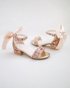 Rock glitter block heel sandals with added satin bow adds a sparkles and romantic to any occasions. It is a great combination and will definitely be a favorite. Perfect for flower girls, birthday, quinceañera, or any special events.DETAILS:HEEL HEIGHT: 1.25 inchesUPPER: Synthetic upper and liningMATERIALS: Manmade outsole Glitter Round Toe Sandals For Prom, Low Heel Glitter Sandals For Prom, Glitter Low Heel Sandals For Prom, Glitter-accented Sandals With Round Toe For Prom, Girls Heels, Glitter Heels, Block Heel Sandals, Low Block Heels, Girls Sandals