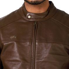 a man wearing a brown leather jacket