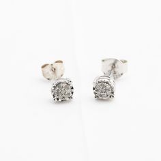 "Hello. These are a nice pair of diamond cluster \"iced\" stud earrings in sterling silver. They are marked 925 sterling silver. The diamonds are genuine earth-mined stones. The backings are two different sizes. One of the earrings is slightly bent. Thanks for looking!" Sparkling Diamond Cluster Earrings In Diamond White, Classic Sterling Silver Cluster Earrings With Diamond Accents, Classic Silver Cluster Diamond Earrings, White Gold Cluster Earrings With Diamond Accents, Sparkling White Gold Diamond Earrings For Anniversary, Sterling Silver Cluster Diamond Earrings For Anniversary, Diamond White Sparkling Cluster Earrings For Anniversary, Sparkling Diamond White Cluster Earrings For Anniversary, Sparkling White Gold Cluster Earrings For Anniversary