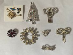 Vintage Brooch Lot This sparkling ensemble includes 8 darling brooches (one is a clip) all intact, no stones missing with working clasps. Formal Rhinestone Costume Brooches, Vintage Brooches With Sparkling Stones For Gift, Vintage Brooches With Sparkling Stones As Gift, Vintage Sparkling Brooches For Formal Wear, Vintage Sparkling Brooches For Formal Occasions, Vintage Bling Brooches For Anniversary, Vintage Sparkling Brooch For Formal Occasions, Formal Costume Jewelry Brooches With Sparkling Stones, Anniversary Costume Jewelry Brooches With Rhinestones