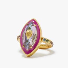 a gold ring with an amethorate and multicolored stones on it