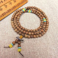 Fashion Element: Ruyi, Auspicious Pattern Style: Retro Spiritual Festival Bracelet With 108 Beads, Spiritual Festival Bracelets With 108 Beads, Spiritual Rosary Bracelet With 108 Beads, Brown Beaded Bracelets For Meditation And Festivals, Bohemian Adjustable Rosary Bracelet With 108 Beads, Spiritual Wooden Beads Bracelets For Festivals, Brown Bracelets For Meditation And Festivals, Beads Bracelets, Door Frame