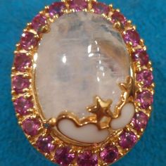 New Kuisa Rainbow Moonstone, Orissa Rhodolite Garnet Celestial Ring In Vermeil Yg Over Sterling Silver (Size 5.0) (7.10 G) 15.35 Ctw Nib! The Top Of The Ring Measures 26mm X 20mm. White Moonstone Ring With Gemstone Accents, White Rings With Gemstone Accents For Gift, White Moonstone Cabochon Crystal Ring, White Moonstone Crystal Ring With Natural Stones, White Moonstone Rings With Gemstone Accents, Celestial White Moonstone Ring As Birthstone, Celestial White Moonstone Birthstone Ring, Celestial Style White Moonstone Birthstone Ring, Unique White Crystal Ring With Gemstone