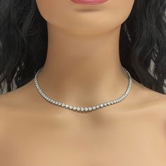 A classic and elegant everyday or occasional wear the Beauvince Adjustable Length Cupcake Tennis Necklace is a timeless and versatile piece of jewelry. It can we worn at any length between 13 inches 30 inches ranging from a choker to a long layer. Total Diamond Weight: 7.18 ct Diamond Color: G - H Diamond Clarity: SI - I (Slightly Included - Included) Metal: 14K White GoldMetal Weight: 18.35 gms Setting: Prong Set Length: 13 - 30 inches Formal Single Strand Round Diamond Necklace, Formal Single Strand Diamond Necklace, Luxury Single Strand Diamond Necklace For Formal Occasions, Luxury Single Strand Diamond Necklace For Formal Events, Formal White Single Strand Diamond Necklace, Classic Single Strand Round Diamond Necklace, Classic Round Single Strand Diamond Necklace, Classic Silver Single Strand Diamond Necklace, Dazzling Single Strand Necklace For Anniversary