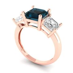 an engagement ring with three stones on the side and one stone in the middle,