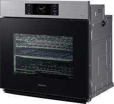 an oven with the door open and shelves full of food