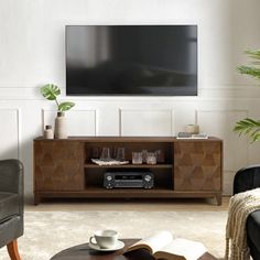 a living room scene with focus on the entertainment center and coffee table in the foreground