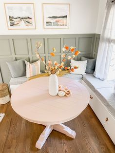 a table with flowers in a vase on it and the words diy bench seating with ikea besta units