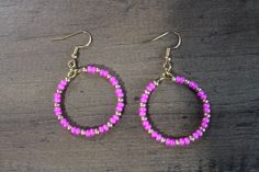 These beaded dangle hoops are handmade for sensitive ears.  The hooks are made of 316L surgical stainless steel.  I have an assortment of colors and designs for you to pick from.  These specific earrings are 30mm. Please feel free to contact me with any questions.  Thank you for viewing my page! Metal Hoop Earrings With Colorful Beads As Gift, Pink Wire Wrapped Beaded Earrings With Round Beads, Pink Hypoallergenic Beaded Earrings With Round Beads, Gift Dangle Hoop Earrings With Spacer Beads, Pink Wire Wrapped Beaded Earrings, Nickel-free Pink Beaded Earrings, Pink Hypoallergenic Adjustable Beaded Earrings, Adjustable Hypoallergenic Pink Beaded Earrings, Nickel-free Pink Beaded Hoop Earrings