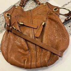 Authentic Oryany Leather Hobo Tote/Shoulder Bag With Gold Hardware. Very Gently Used And Loved! Lots Of Compliments. This Bag Is Practical, Spacious And Super Classy That Will Never Go Out Of Style. Condition Is Beautiful! Lots Of Zippers And Pockets, All Sturdy And Strong, Leather Is Very Luxurious And Healthy. For All My Listings, Reasonable Offers Are Welcome, Scamming Is Not! Every Item Sold Is Video Recorded And Packaging Documented Designer Hobo Bag With Gold-tone Hardware And Double Handle, Designer Hobo Bag With Leather Handles, Designer Hobo Shoulder Bag With Adjustable Strap, Designer Hobo Bag With Gold-tone Hardware For Daily Use, Designer Hobo Bag With Handle Drop, Designer Hobo Bag With Gold-tone Hardware, Designer Crossbody Hobo Bag With Leather Handles, Designer Hobo Shoulder Bag With Leather Handles, Designer Hobo Bag With Double Handle And Adjustable Strap