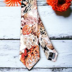 Treat yourself with a new pattern and splash of color to your look with this unique tie. 100% Cotton Handmade Package Includes: Tie Length: 59" Width: 3" Warm iron if needed White Floral Print Ties For Summer, Multicolor Standard Tie For Summer, Summer Floral Print Tie, Summer Floral Print White Ties, Summer White Floral Print Ties, Summer Floral Print Standard Tie, Multicolor Ties For Spring Black Tie Events, Multicolor Ties For Black Tie Events In Spring, White Floral Print Suit And Tie Accessories For Summer