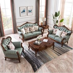 a living room with couches, chairs and a coffee table in front of two windows