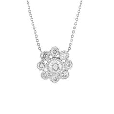 Our Rosetta White Diamond Necklace will make an heirloom piece for ages to come, with sparkling old mine cut white diamonds clustered into a romantic floral shape. We've added exquisite milgrain details around each bezel setting for a dazzling vintage touch. The chain includes a jump ring at 16", meaning you can swap between 16" and 18" length for greater layering variety. 18K Yellow Gold 9 Old Mine Cut White Diamonds Total Diamond Weight: 0.75ct Pendant Diameter: 12mm Chain Length: 18" White Gold Diamond Necklace With Filigree For Anniversary, Anniversary Diamond Pendant Necklace With Filigree, Anniversary White Gold Diamond Necklace With Filigree, Luxury Silver Diamond Necklace In Flower Shape, Luxury Silver Flower-shaped Diamond Necklace, Heirloom Diamond Necklace With Intricate Design, Classic Silver Diamond Necklace With Intricate Design, Fine Jewelry Diamond Necklace With Intricate Design, White Gold Diamond Necklace With Intricate Design For Anniversary