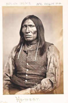 an old black and white photo of a native american man