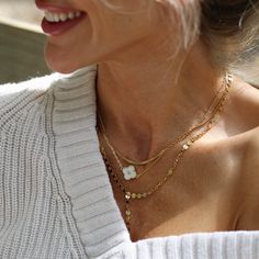 This delicate necklace showcases a dainty 14k gold chain, exuding subtle sophistication. At its center, a 14mm mother-of-pearl connector catches the light with a soft, radiant glow, adding a timeless touch. Designed with adjustable sizing for the perfect fit, this versatile piece can be worn alone or layered with others. Whether for everyday wear or a special occasion, it brings a sense of effortless elegance to any outfit. Dainty Chain, Clover Necklace, Effortless Elegance, Delicate Necklace, Spring Collection, Gold Chain, Ring Shopping, Gold Chains, Mother Of Pearl