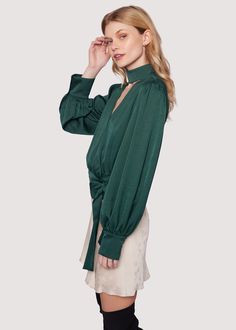 Elevate your style with the Calla Green Wrap Top! This chic piece that's perfect for fall combines a sophisticated mock neck with an open V-neck, elegantly wrapping around the waist and tying into a bow, while long loose sleeves add an extra touch of flair. WTWC02627-2 Imported Model is 5 ft 9 inches; Bust: 32", Waist: 23.5", Hips: 35" and wearing a size Small Runs true to size Hand wash or wash with gentle cycle with cold water with like colors, Air dry to avoid shrinkage. Green Wrap, Loose Sleeves, Swim Accessories, Short Rompers, Wrap Top, Skirt Pants, Air Dry, Mock Neck, Different Styles