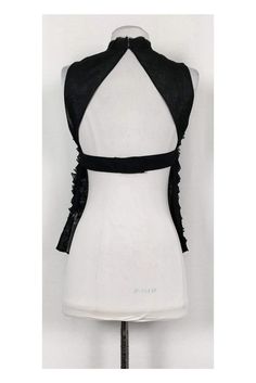 Sexy tank top from Robert Rodriguez. Made in a lightweight silk with a ruffled fabric and a rhinestone trim at the front. A flirty exposed back tops off the look. Size 2 100% silk Ruffled fabric Open back Rhinestone detail on front Tie w/ snap button closure on back Semi-sheer Unlined Raw edge along neckline and hem Bust 31" Waist 30" Shoulder to hem 22" Elegant Stretch Backless Tank Top, Spring Evening Tank Top With Built-in Bra, Stretch Tie Back Top For Party, Stretch Tie-back Top For Party, Sleeveless Tie Back Top For Party, Fitted Backless Tank Top For Evening, Edgy Party Tops With Built-in Bra, Elegant Backless Tie-back Tank Top, Elegant Evening Halter Tank Top