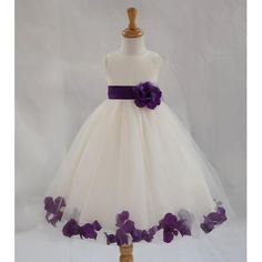 a white dress with purple flowers on it