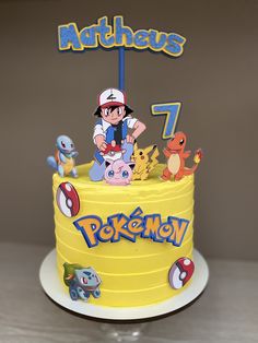 a pokemon themed birthday cake with pikachu and friends