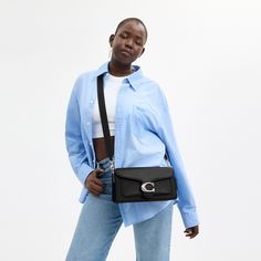 A modern take on an archival 1970s Coach design our structured Tabby shoulder bag is crafted of polished pebble leather. Finished with our Signature hardware for an iconic touch the compact 26 features two detachable straps to carry by hand style as a short shoulder bag or wear crossbody. | Coach Tabby Shoulder Bag 26 - Women's - Silver/black Coach Shoulder Bag With Detachable Strap For Work, Coach Shoulder Bag With Adjustable Strap For Work, Modern Coach Satchel With Branded Hardware, Modern Coach Shoulder Bag With Branded Hardware, Coach Shoulder Flap Bag With Adjustable Strap, Modern Coach Flap Bag With Detachable Strap, Chic Coach Flap Bag With Adjustable Strap, Coach Shoulder Bag With Adjustable Strap, Versatile Coach Satchel With Detachable Strap