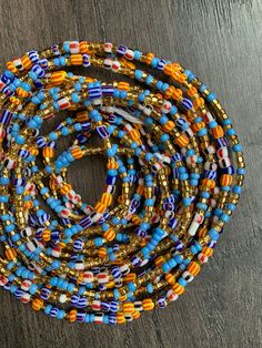 These beads come in TIE ON only, they are 45"-52" long and self adjustable based on your waist size. ★ Please note, the Bead option you pick is exactly what you'll receive. ★ The listed prices are for one strand each. For multiple strands you'll have to indicate from the quantity section in your cart. Uses of Waist beads ★ Cultural and Spiritual Reasons ★Waist beads as ornaments as well as for symbolic adornment, ★ which serves as a sign of wealth, femininity or aristocracy, as well as spiritual Cheap Colorful Waist Beads For The Beach, Adjustable Waist Beads With Large Beads As Gift, Multicolor Waist Beads With Large Beads For Festival, Multicolor Large Beaded Waist Beads For Festival, Blue Colorful Waist Beads As Gift, Multicolor Large Beaded Waist Jewelry For Festival, Blue Round Beads Waist Beads For Gift, Blue Waist Beads Gift, Adjustable Multicolor Waist Beads With Large Beads