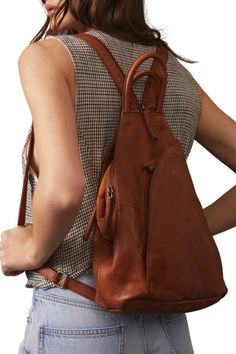 a person with a brown backpack Stylish Backpack, Fall Bags, Leather Sling Bag, Stylish Backpacks, Convertible Bags, Bag Ideas, Bag Collection, Zipper Detail, Chic Design