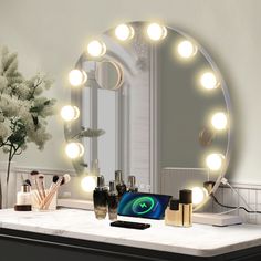 a vanity with a mirror and lights on it