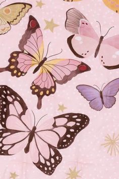 a bunch of butterflies on a pink background