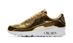 The Women’s Nike Air Max 90 “Metallic Pack - Gold” features a luxurious gold makeover for a contemporary lifestyle take on the iconic runner. Releasing alongside equally opulent metallic silver and bronze colorways as part of Nike’s “Metallic Pack” of Air Max 90s, this “Gold” iteration features a shiny all-over gold leather finish across the upper. A contrasting solid white midsole and outsole with a visible Air window all sit below the shining upper. The Air Max 90 "Metallic Pack" for women rel Gold Nike Shoes, 70s Converse, Air Max 90 Leather, Nike X Travis Scott, Air Max 90 Women, Gold Nike, Air Max Day, Low Air Jordan 1, Converse Run Star