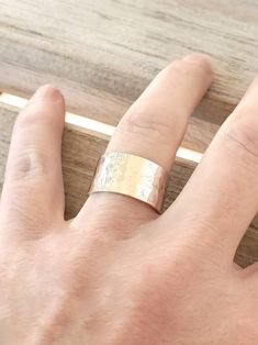 "Our hammered Sterling Silver thumb ring is amazing. Hammered and polished, it's simple and elegant. The ring is roughly 3/8\" wide. SIZING: Did you know that ring size changes as your weight changes? Did you lose weight? You may need a smaller size. Have you gained weight? You may need a larger size. Our cuffs are adjustable, so expanding them up a ring size is easy. Our bands are not adjustable, so it's highly recommended you get an accurate ring size before ordering. Wider rings can fit tight Everyday Hammered Wide Band Jewelry, Everyday Wide Band Hammered Jewelry, Minimalist Hammered Wide Band Jewelry, Hammered Open Wide Band Promise Ring, Hammered Sterling Silver Wide Band Ring For Anniversary, Sterling Silver Hammered Wide Band Ring For Anniversary, Hammered Wide Band Ring In Sterling Silver, Anniversary, Hammered Wide Band Open Ring As Gift, Gift Wide Band Ring With Hammered Open Design