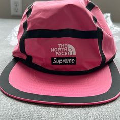 North Face And Supreme Collab Camp Hat. Brand New With Tags Pink Hat For Outdoor Activities In Spring, Pink Hats For Outdoor Spring Activities, Pink Hat For Spring Outdoor Activities, Pink Travel Hat With Short Brim, Sporty Flat Brim Hats For Camping, Pink Short Brim Hat For Travel, Pink Snapback Hat For Outdoor, One Size Fits Most, Pink Snapback Cap For Outdoor, Pink Adjustable Snapback Hat For Outdoor