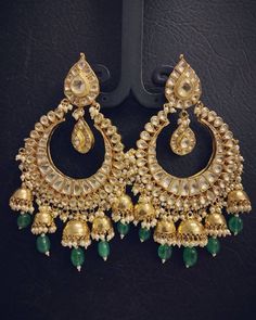 Antique Gold Finish Silver Jewelry Statement Earrings Kundan Bridal Jewelry Earrings for Indian and Pakistani Brides for all Occasions. *It is a pair of Handmade Indian Kundan Bridal Earrings. *Its made from Silver and Copper Pink ,Green and White Multi-color Kundan Stones Settings with 22k gold Plating. *It is a beautiful Ethnic Green Emerald Statement Earrings. *Earrings are 3.4 Inches Long. *Our all jewelry is made from semiprecious stones and beads. *WARRANTY: ITS GENUINE HANDMADE JEWELRY AN Temple Jewelry Danglers For Diwali Weddings, Diwali Wedding Temple Jewelry Danglers, Temple Jewelry Stone Work Danglers For Wedding, Traditional Festive Chandbalis With Hand Set Details, Traditional Festive Hand Set Chandbalis, Festive Traditional Hand-set Chandbalis, Wedding Temple Jewelry Danglers With Cutdana, Wedding Temple Jewelry Danglers With Tilla, Wedding Cutdana Danglers For Eid