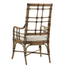 the chair is made out of bamboo and has a white cushion