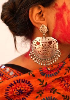 Jhumri Intricate Carved Classic Chandbali Earrings. All our jewellery is handcrafted. Crafted in Oxidized 925 Silver. This piece of art is absolutely extraordinary and requires long involvement with metal handling, and individual devotion for magnificent finishing. Length : 10cm Max width : 6cm 92.5 Silver, Hallmarked Available as a Pair Care tips: Keep jewelry away from hard and rough objects. Store your jewellery in a soft lined box or pouch. This unique designer earring is hand-crafted from solid sterling silver , it is vintage finished and oxidised for ethnic look, a unique work of our craftsmen. Please feel free to contact us anytime regarding any quarries related to our jewelry. We will be pleased to assist you. We are a duo of IIT Roorkee graduate, ex Flipkart and an MBA from Nirma Unique Oxidised Earrings, Silver Temple Jewelry Chandelier Earrings With Intricate Design, Silver Temple Jewelry Chandelier Earrings With Latkans, Silver Bridal Earrings With Intricate Temple Jewelry Design, Silver Bridal Earrings With Intricate Design For Ceremonial Occasions, Ceremonial Silver Bridal Earrings With Intricate Design, Ceremonial Bridal Earrings With Intricate Design In Silver, Traditional Silver Chandelier Earrings With Oxidized Finish, Silver Chandelier Earrings With Intricate Design For Festive Occasions