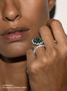 a close up of a person wearing a ring