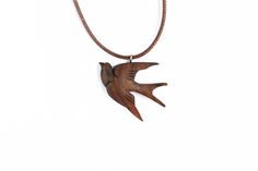 Swallow necklace, This necklace is completely handmade and handcarved I used walnut wood in this work, Because this wood has very beautiful and soft for carving and woodwork Product Dimensions Necklace: 40-45 cm adjustable Pendant: 35 mm x 30 mm This beautiful pendant can be one of the best and most special gifts for your partner or someone you love Note: this is a natural product from wood. It is almost impossible to create a standard. There may always be slight variations in color and grain. No one adherent is 100% like the other.  If you have any questions about this item or any other item in my shop , message me and i will be more than happy to help Also check out our Instagram page , were we have very beautiful pendants, just like this made by us. https://www.instagram.com/choobino_/ Carved Natural Wood Necklaces, Carved Natural Wood Jewelry, Rustic Natural Wood Necklace, Carved Wood Jewelry, Gifts For Your Partner, Swallow Necklace, Love Note, Wooden Necklace, Handmade Wire Jewelry