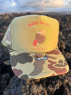 Wahi Ka Niu means break the coconut.  This hat is all aloha Summer Beach Trucker Hat, 5-panel, Summer Beach Trucker Hat, 5-panel Design, Summer Beach Trucker Hat 5-panel, 5-panel Trucker Hat For Beach Summer, Fun Short Brim Trucker Hat For Beach, Fun Short Brim Trucker Hat For The Beach, Summer Vacation Trucker Hat With Wide Brim, Adjustable 5-panel Sun Hat For Beach, Green Summer Trucker Hat For Beach