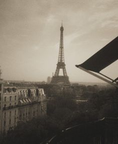 the eiffel tower in paris is seen from across the city's rooftops